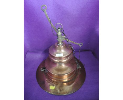 An industrial copper and brass ceiling light shade possibly nautical related with swinging mechanism