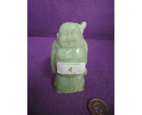 A hand carve Jade figure of a travelling Buddah