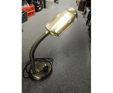 A brass effect reading lamp or similar