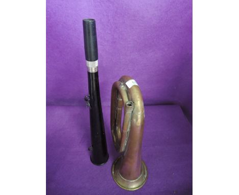 An Acme horn and similar brass bugle