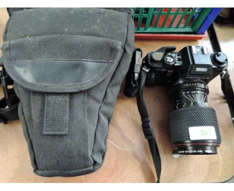 A Pentax Program A camera with Tonkina 70-210mm lens and soft camera bag