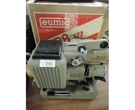 A boxed Eumig P8m projector