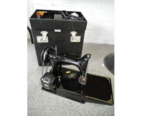 A sought after sewing machine by Singer electric motor with casing Cat. No. CAK 6 12NO INSTUCTION MANUAL AND UNTESTED