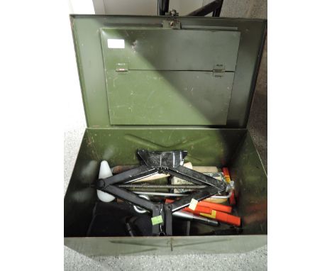 A selection of tools and hardware in metal chest