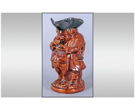 Rockingham Treacle Glaze 'Snuff Taker' Toby Jug, probably designed by Daniel Greatbatch, an English potter, at the Bennington