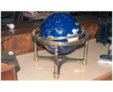 Reproduction Enamelled World Globe on a brass four legged stand. With a compass combined cross stretcher.