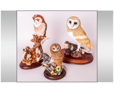 Three Various Owl Figures, the first, at 7.75 inches high including the base, from The Leonardo Collection, the one with the 