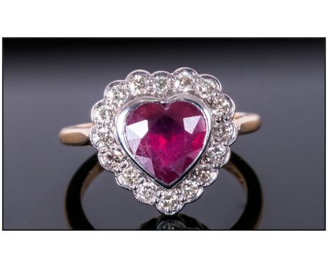 18ct Gold Heart Shaped Ruby & Diamond Ring The heart shaped ruby of good colour surrounded by 16 Diamonds. Size P. Fully Hall