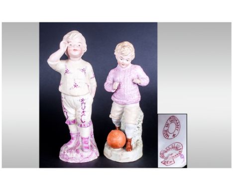Heubach Hand Painted Bisque Sporting Figure ' Young Boy Playing Rugby'; 7 Inches high, plus a further Heubach figure of a boy