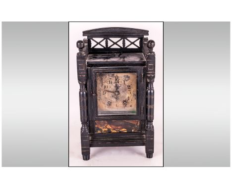 Black Ebonised Aesthetic Movement Mantle Clock with turned spindles to the sides and a silvered dial, with a painting of a bi