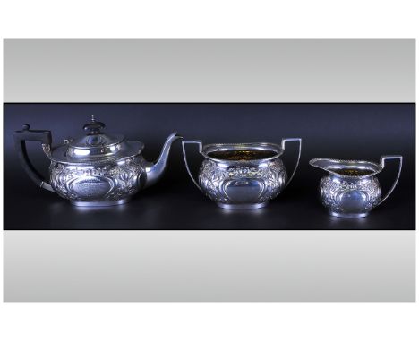 Three Piece Silver Tea Service, Embossed Art Nouveau Design, Engraved Cartouche ''Presented To R U Stubbs Esq By The Weaver W