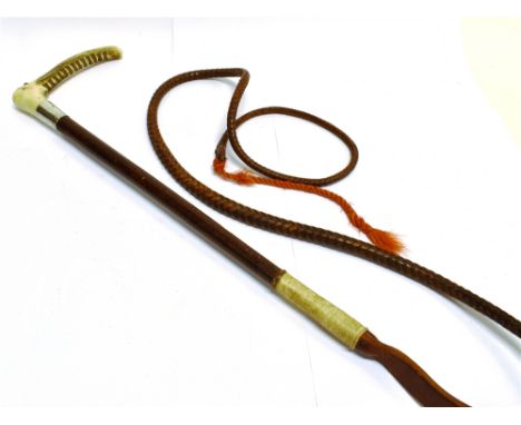 A GENT'S HUNTING WHIP with antler grip, silver collar and plaited leather shaft and leash