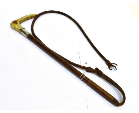 A LADY'S/CHILD'S HUNTING WHIP, by Swaine and Aderley, with antlers grip, silver collar and plaited leather shaft and leash