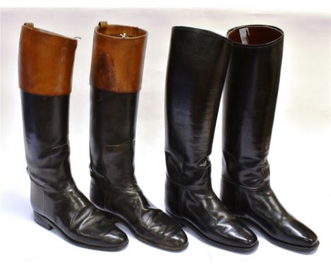 A PAIR OF BLACK LEATHER HUNTING BOOTS with brown tops, and another black pair of boots