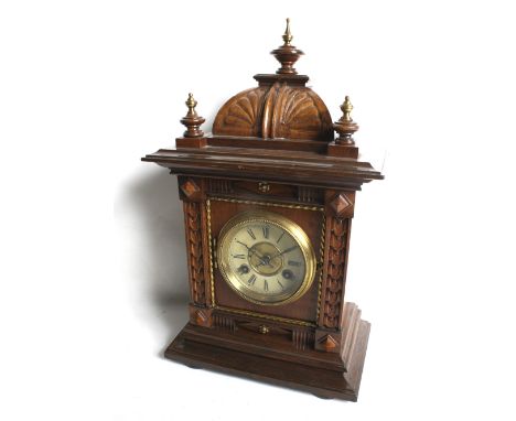 An early 20th century German oak cased mantel clock. With a Junghan 8 day movement, striking to a gong. Roman numerals, bevel