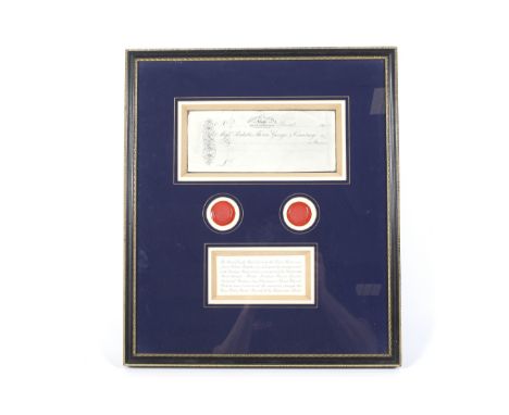 Framed and glazed reproduction 'Bristol Castle' blank cheque and two wax seals. The cheque from 'Ricketts, Thorne, George, & 