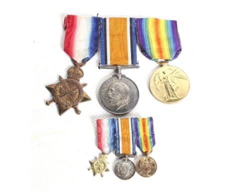 A set of three WWI medals and miniatures, a ship insignia and a cap badge. Comprising the 1914 Star (1336 Pte. J.W.B. Cowlin,