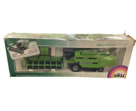 A boxed SIKU 1:16 scale model Deutz-Fahr-Mahdrescher M36.10 Combine Harvester