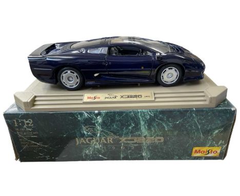 A Maisto 1:12 scale model Jaguar XJ220 (1992) in dark blue