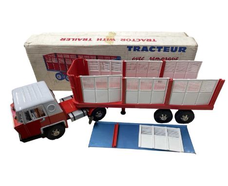 A vintage pressed steel 'tractor and trailer' model by Joustra, in original box.Some some damage and trailer panels warped