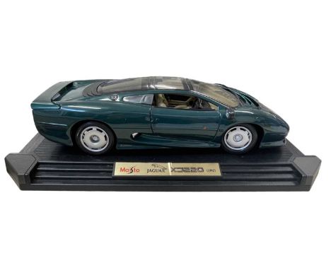 A Maisto 1:12 scale model Jaguar XJ220 (1992) in British Racing Green