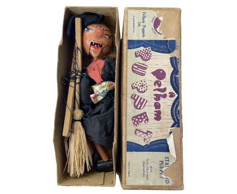 A vintage boxed SM Witch Pelham puppet