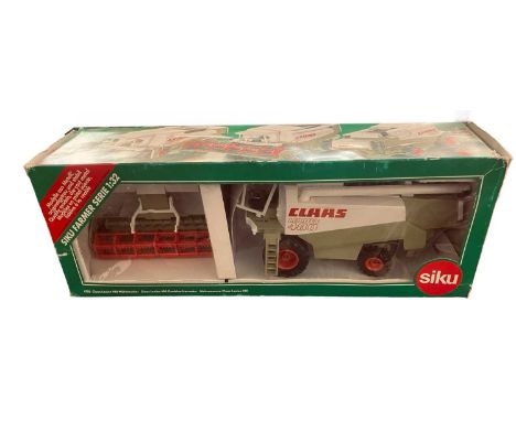 A boxed SIKU 1:32 scale model Claas Lexicon 480 Combine Harvester