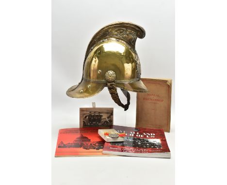 A VICTORIAN BRASS MERRYWEATHER TYPE FIREMAN'S HELMET, with a worn leather and brass chin strap and leather lining, together w