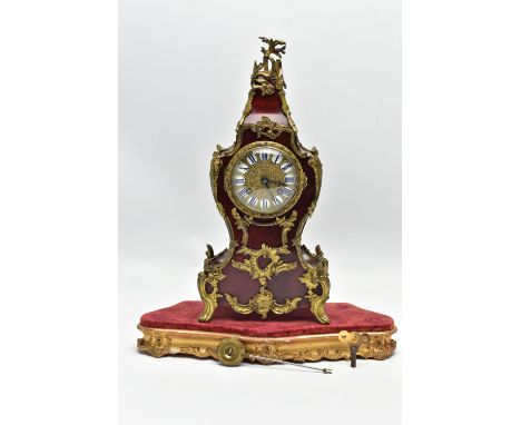 A LATE 19TH/ EARLY 20TH CENTURY FRENCH GILT METAL AND TORTOISESHELL MANTEL CLOCK, the cast brass dial with white and blue ena