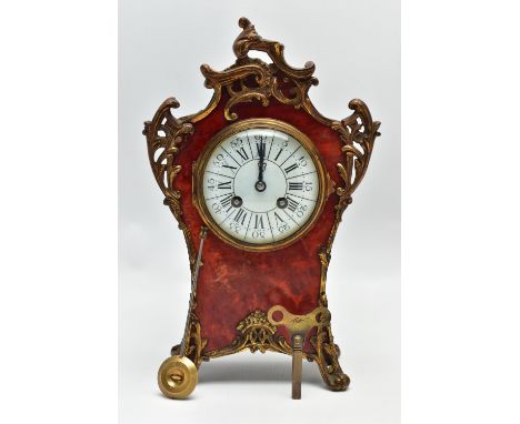 A LATE 19TH CENTURY FRENCH GILT METAL MOUNTED RED TORTOISESHELL MANTEL CLOCK, the 10cm white enamel dial with black Arabic an