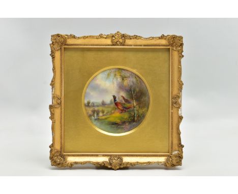 JAMES STINTON FOR ROYAL WORCESTER, a circular framed plaque hand painted with cock and hen pheasant in an Autumnal landscape 