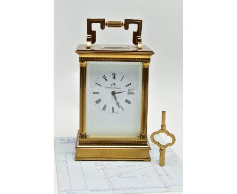 A MATTHEW NORMAN OF LONDON BRASS CASED CARRIAGE CLOCK, Swiss movement, white enamel dial with Roman numerals, columns to all 