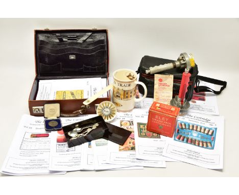 A BOX OF GUN / SHOOTING RELATED ITEMS, comprising a cased bonze Egypt Command Small Arms Meeting 1929 Cavalry Mounted Competi