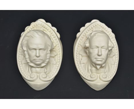 TWO VICTORIAN PARIAN FIRST PERIOD W.H. GOSS WALL VASES MODELLED AS JOHN BRIGHT AND BEACONSFIELD (DISRAELI), the masks on an a