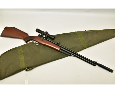 A  .22 '' ROTARY MAGAZINE PUMP UP AIR RIFLE  fitted with a beech stock, in working order and excellent external condition, it