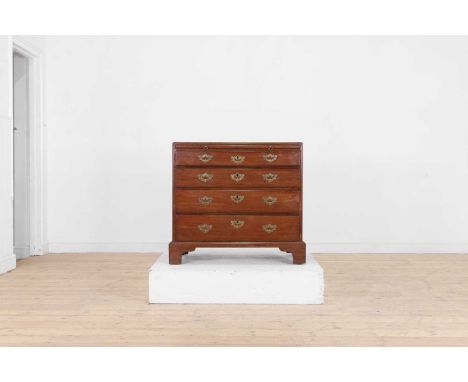 A George III mahogany caddy-top bachelor's chest, late 18th century, with a brushing slide above four graduated long drawers,