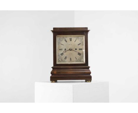 A Regency mahogany bracket clock, the square silvered dial inscribed ‘Holmes, London’, with spandrels with delicate floral en