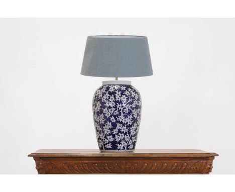 A large porcelain table lamp, 20th century, in the Chinese taste, of baluster form and decorated with flowering prunus, 49cm 