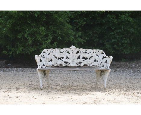A Coalbrookdale-style painted cast iron garden bench, late 19th/early 20th century, in the 'Fern and Blackberry' pattern, sta
