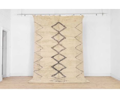 A Berber wool rug, 20th century, Moroccan, with a thick pile woven with geometric motifs, 337 x 200cmProvenance: The selected