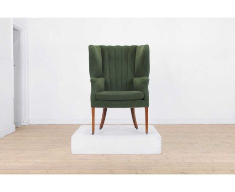 A George III-style mahogany barrel-back armchair, late 19th century, upholstered in green fabric, on tapering square supports