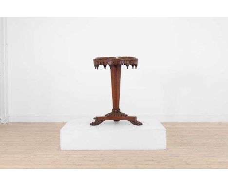 A William IV mahogany occasional table, 19th century, the circular turtle-stone marble top, above a pierced apron, a tapering