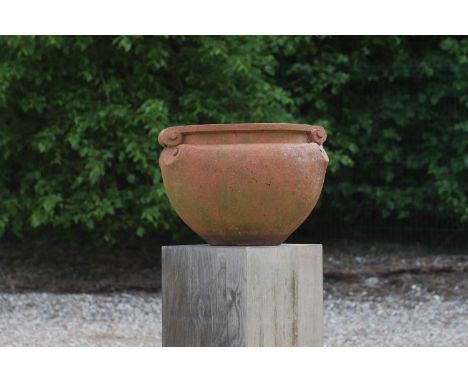 A terracotta garden pot by Compton Pottery,  20th century, with a pair of scroll handles, stamped to the interior 'Compton Po