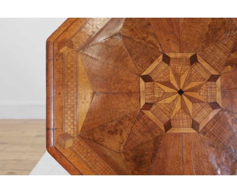 A Victorian walnut and specimen wood occasional table in the manner of Gillows, c.1870, the octagonal top with parquetry inla