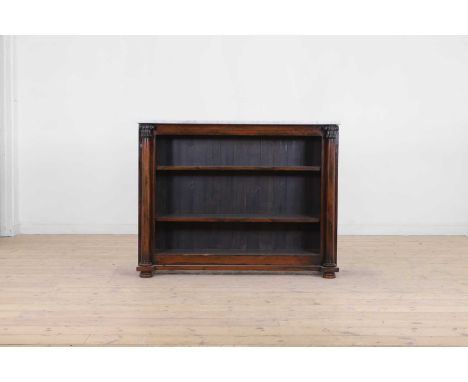 A Regency rosewood bookcase, early 19th century and later, the white marble top above two shelves set between column pilaster