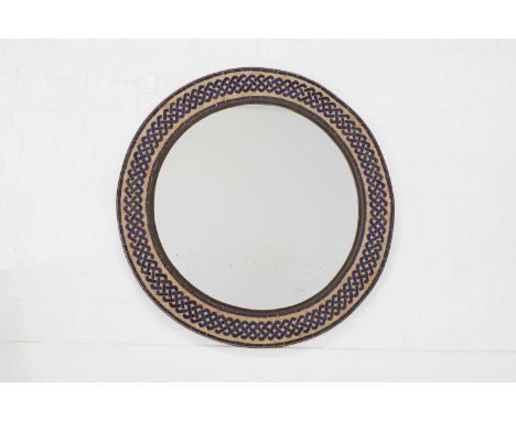 A metal and glazed tile mirror, of recent manufacture, with mosaic lattice decoration, 94cm diameterProvenance: The selected 