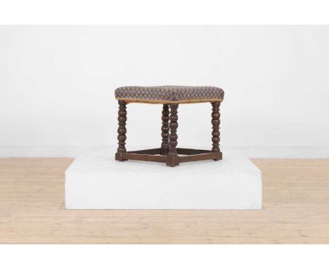 A Charles II oak stool, c.1680, with woven wool seat and bobbin-turned supports, 46cm wide46cm deep40cm high