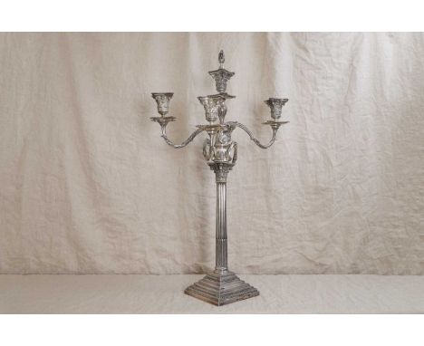 A silver four-light candelabrum, by William Hutton &amp; Sons, London 1889,with scroll arms terminating in Corinthian capital
