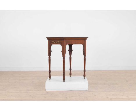 A Victorian Aesthetic Period walnut occasional table, c.1880, in the Moorish taste, the rectangular top above a single drawer