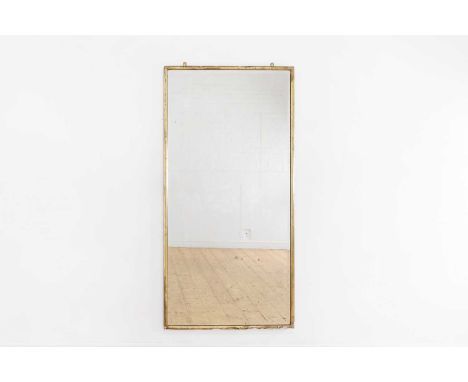 A giltwood pier mirror, early 20th century, French, with a bevelled plate,88cm wide176cm highProvenance: The selected content